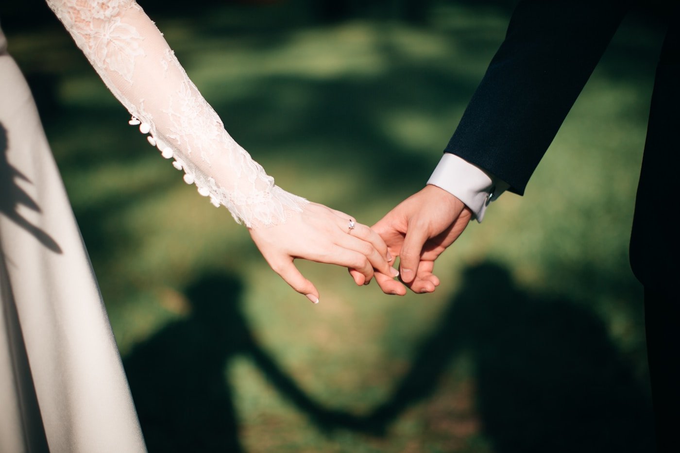 Newly married couple holding hands